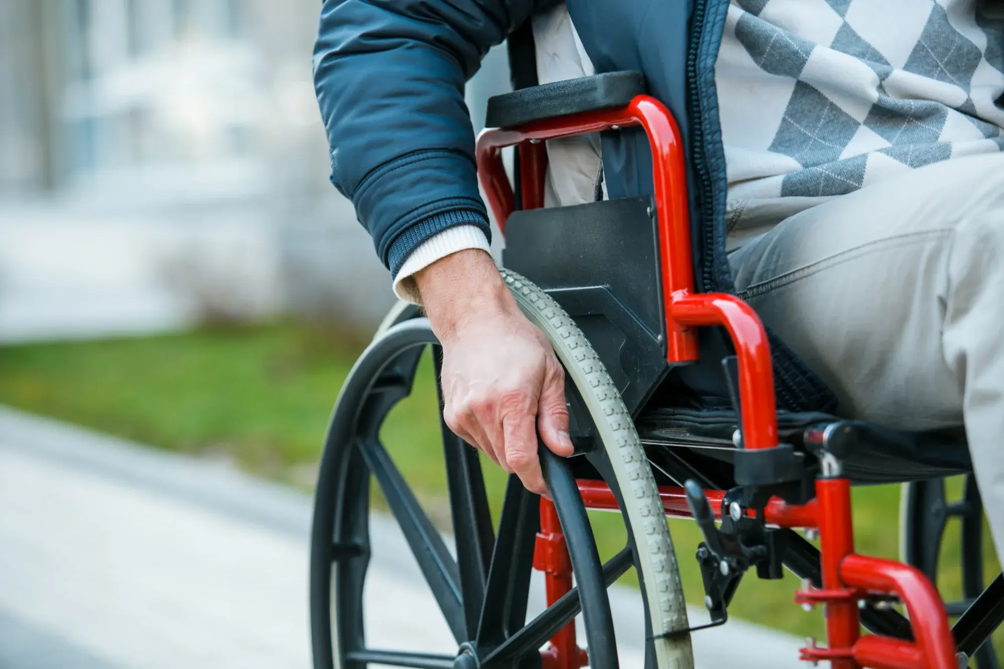 man adjusting wheelchair